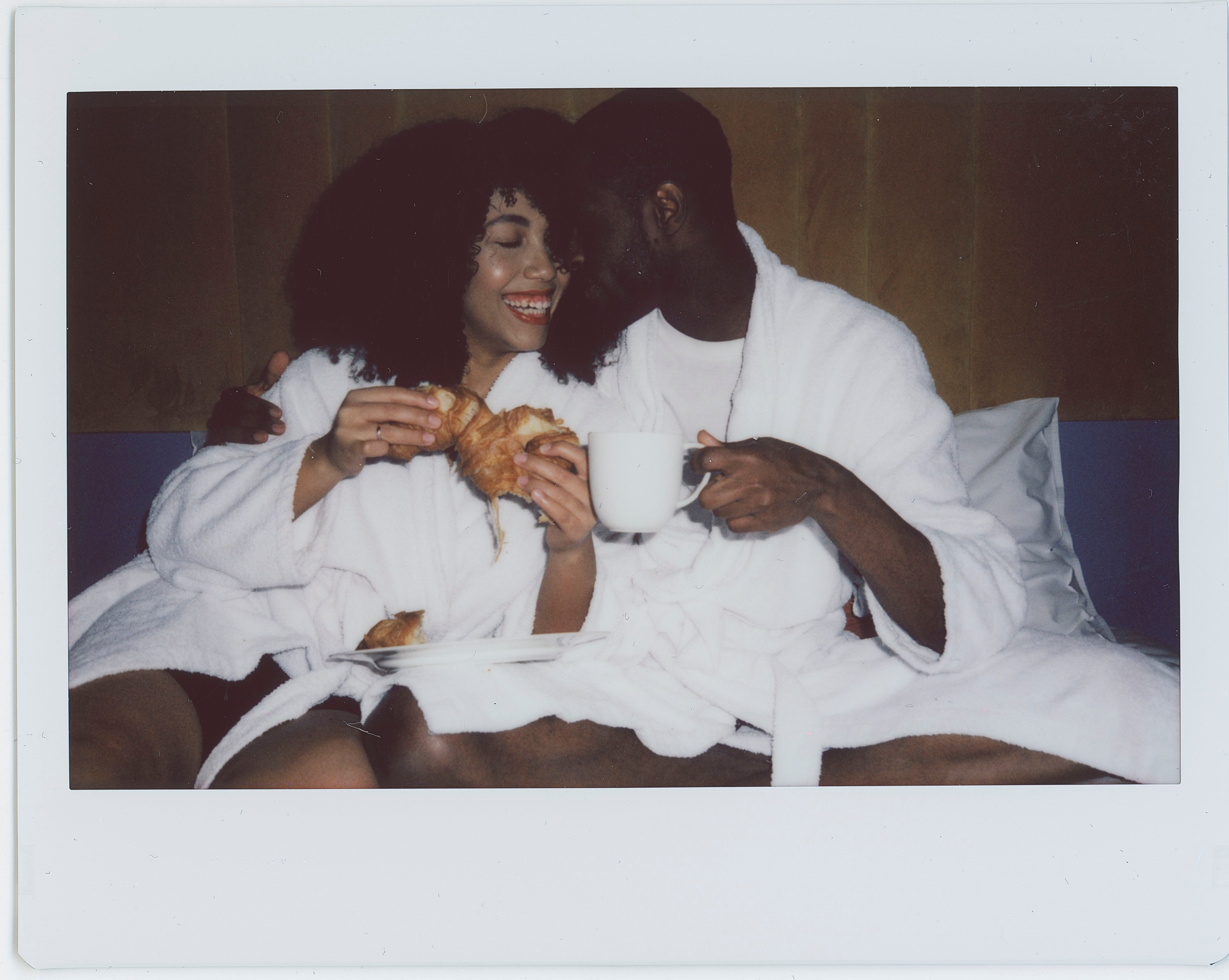 couple in bed polaroid